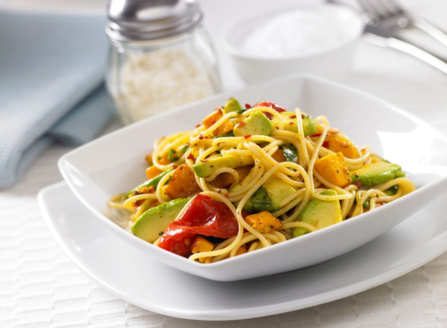 Spaghetti with pumpkin, tomato and avocado