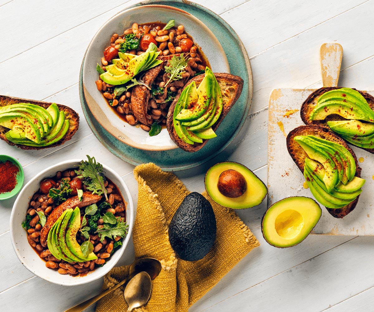 Chorizo, kale and white bean braise with avocado crostini 